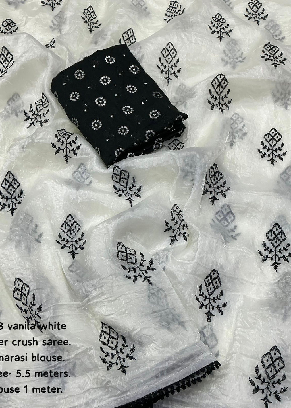 Crush white and black embroidery saree.
