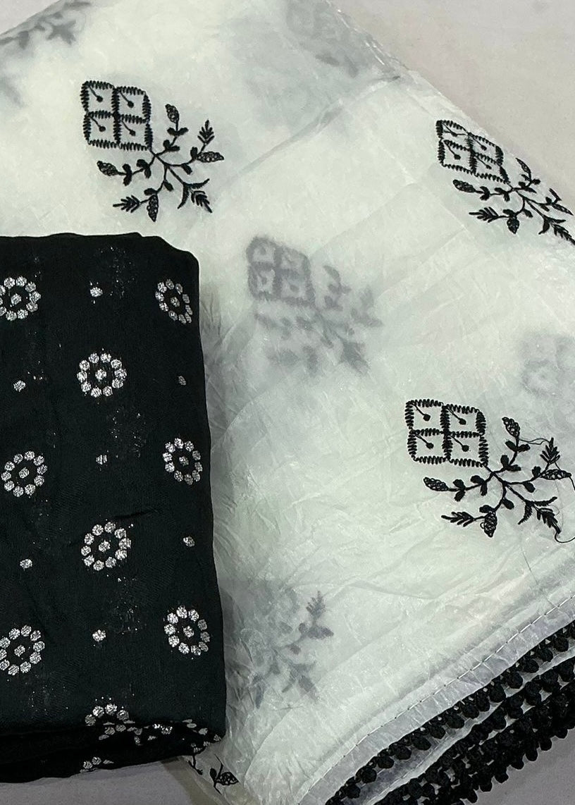 Crush white and black embroidery saree.