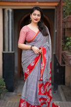 Grey/red ajrakh style saree.