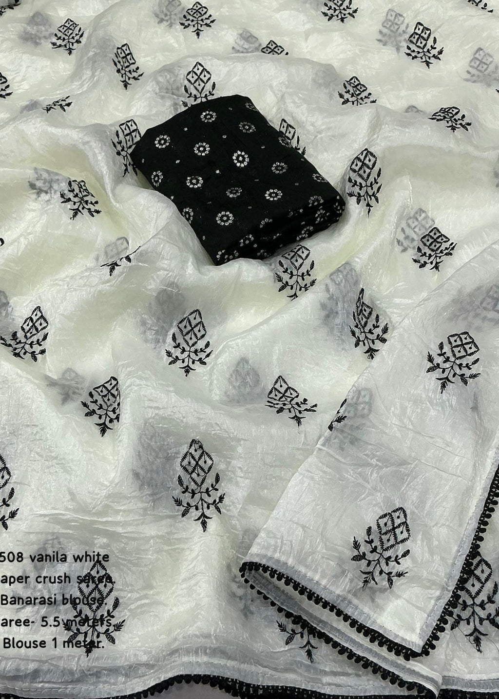 Crush white and black embroidery saree.