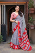 Grey/red ajrakh style saree.