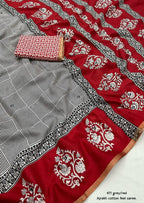 Grey/red ajrakh style saree.