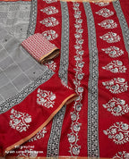 Grey/red ajrakh style saree.