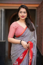 Grey/red ajrakh style saree.