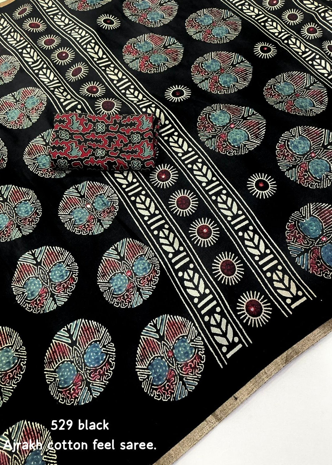 Black poly ajrakh cotton saree.