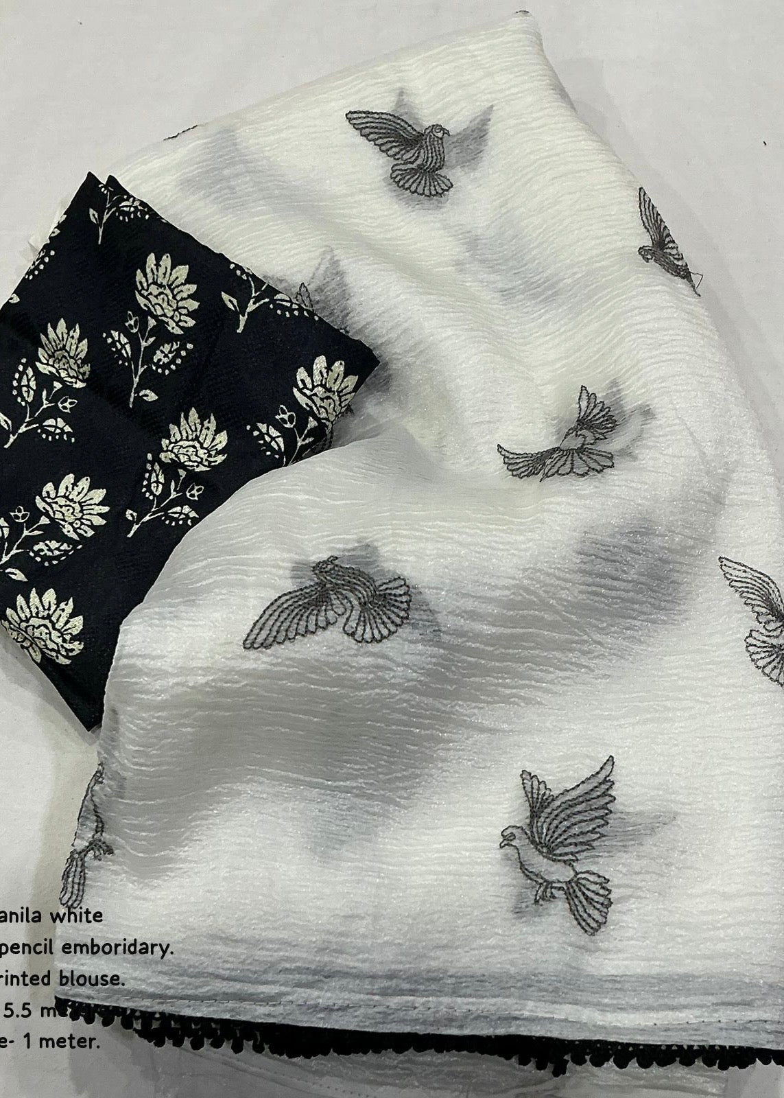 Crush white embroidery saree.
