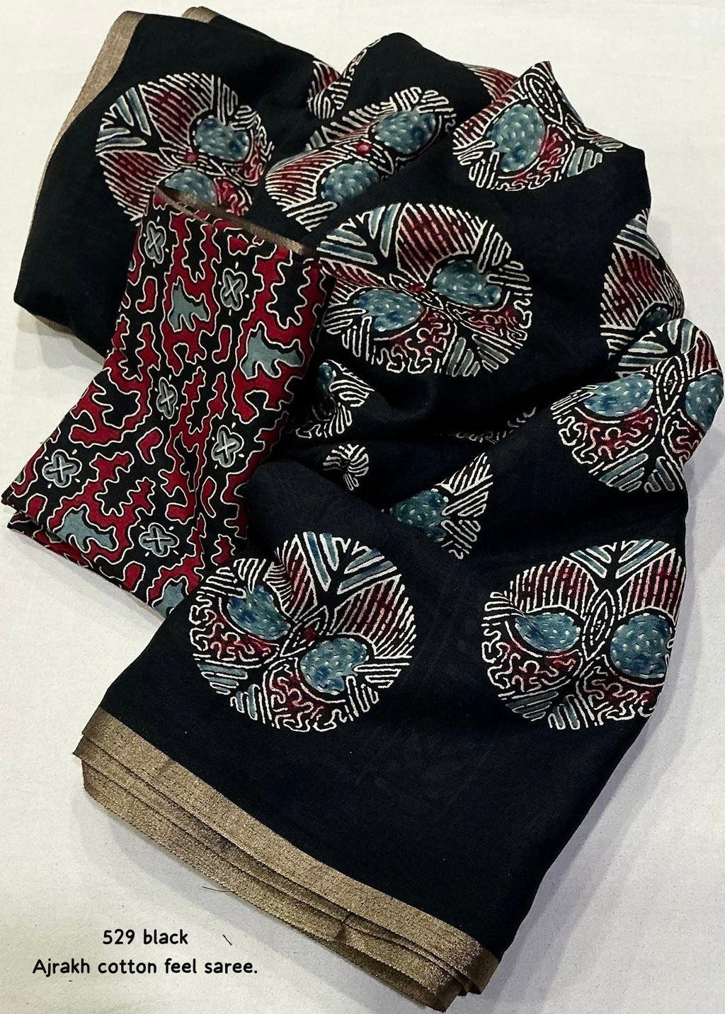 Black poly ajrakh cotton saree.