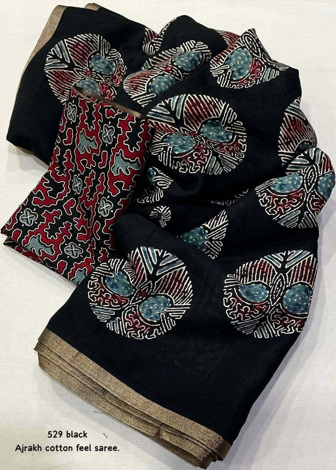 Black poly ajrakh cotton saree.