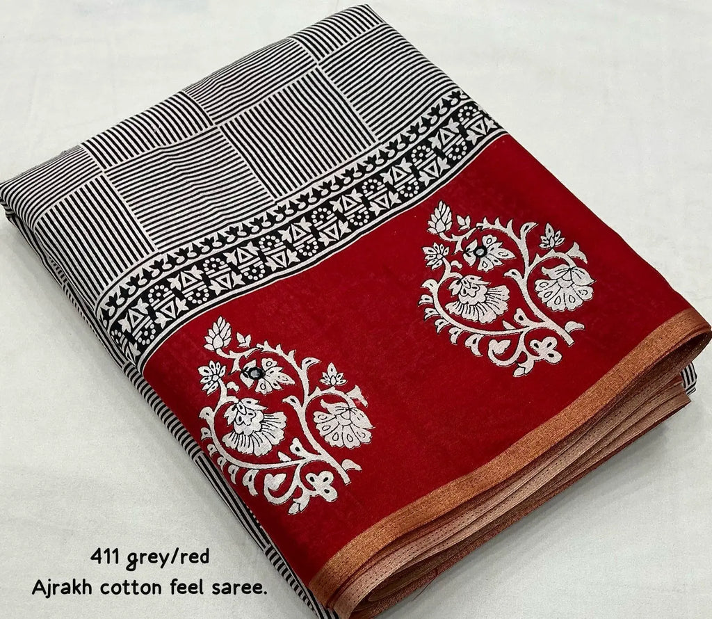 Grey/red ajrakh style saree.