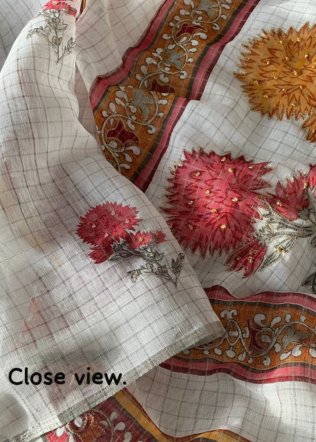 Linen chex floral saree.