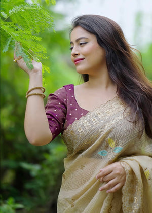 Beige crush embroidery saree.