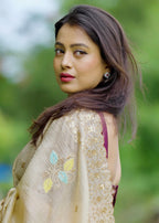 Beige crush embroidery saree.