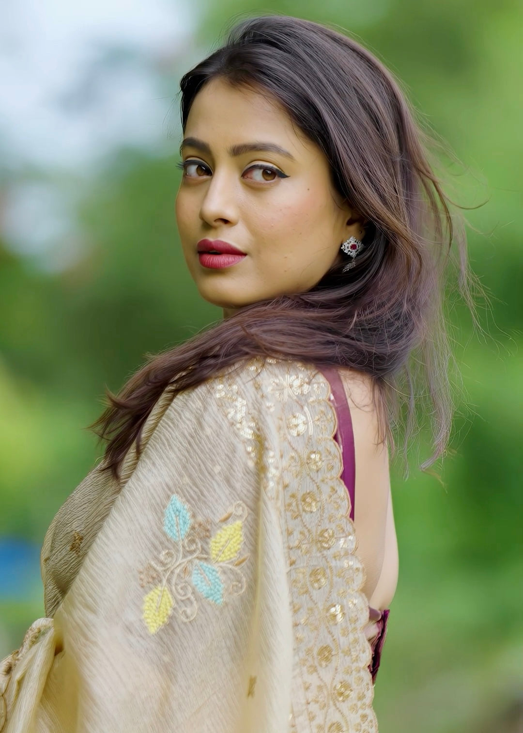 Beige crush embroidery saree.