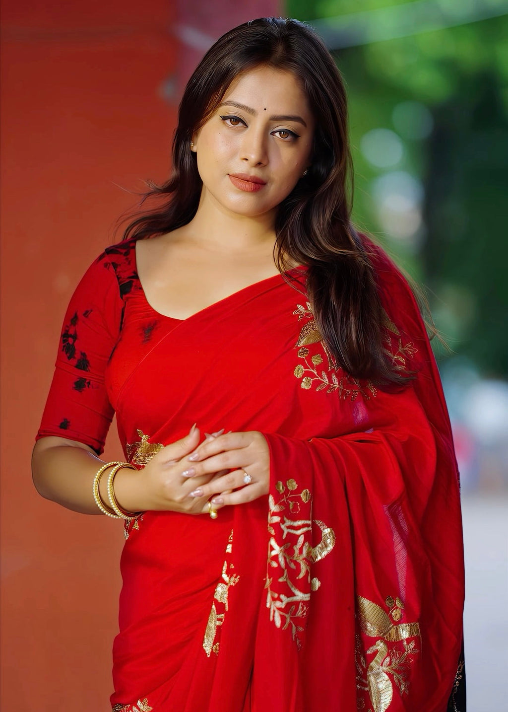 Black red embroidery saree.