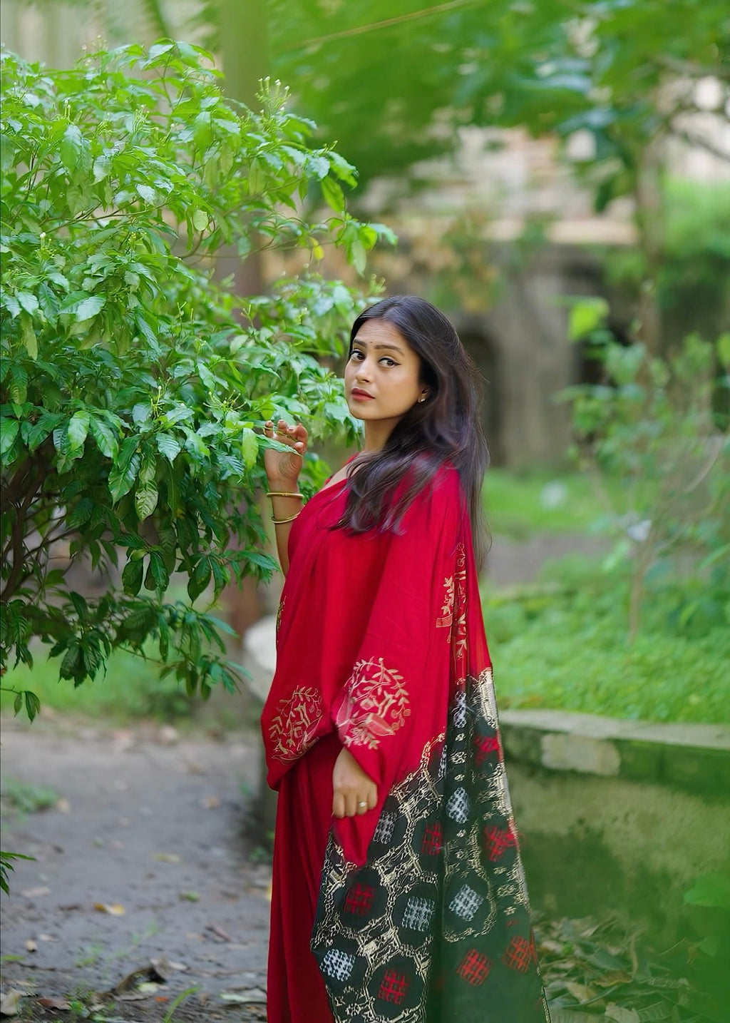 Black red embroidery saree.