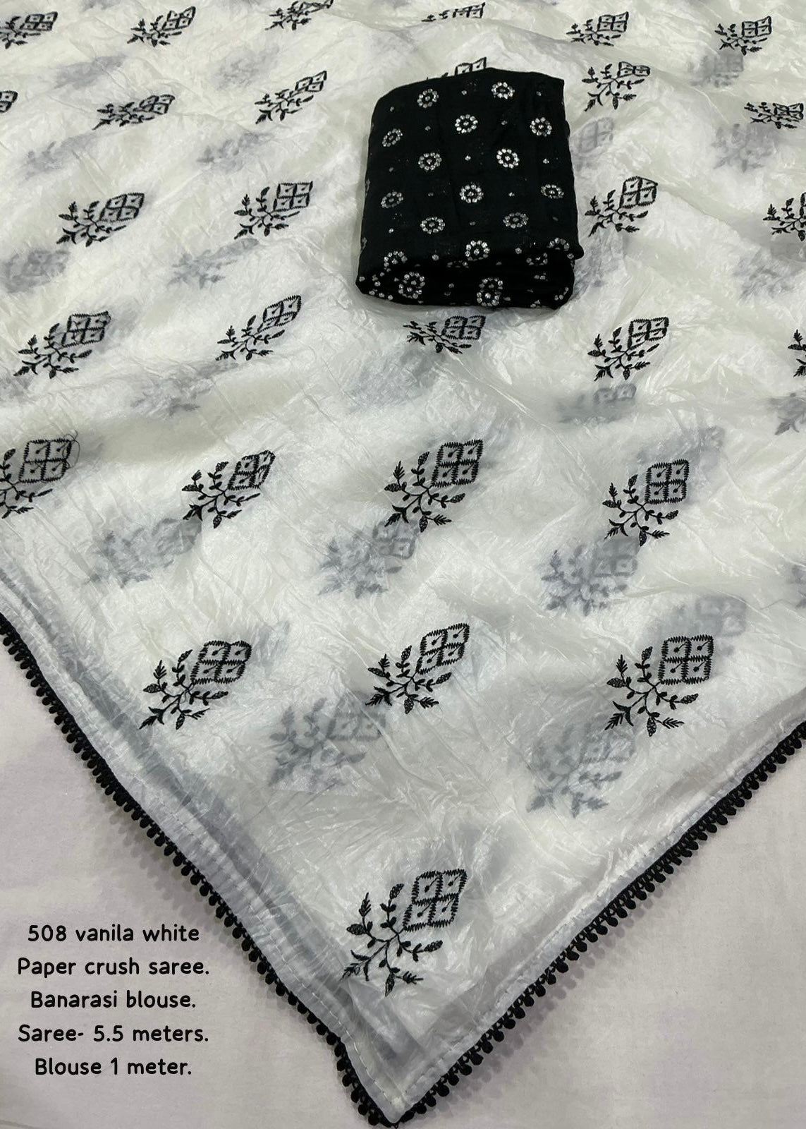 Crush white and black embroidery saree.