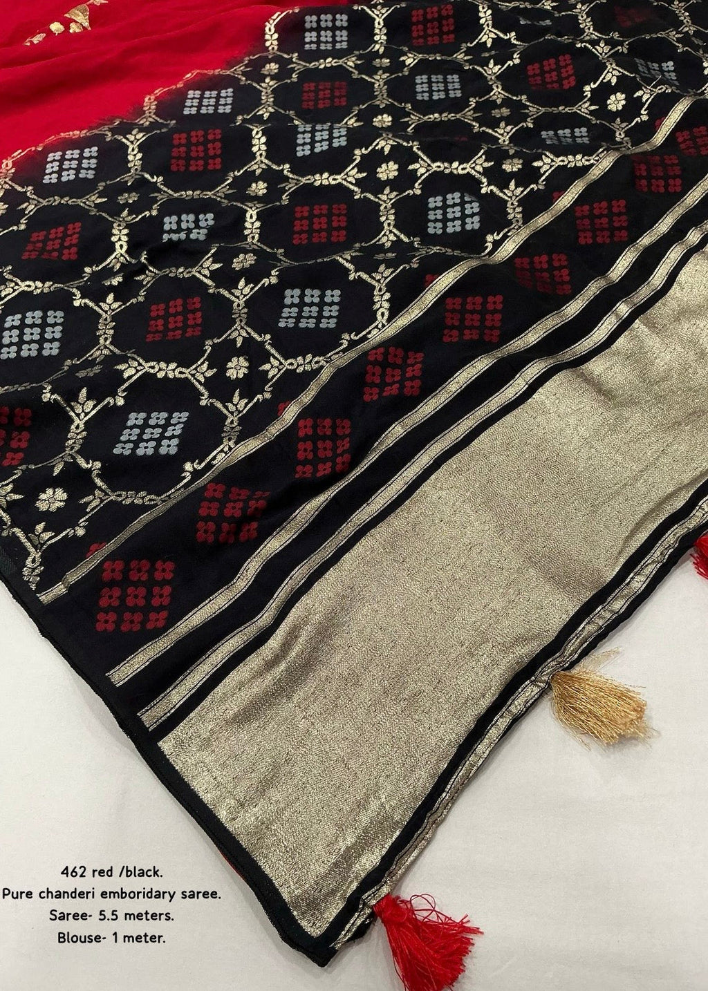 Black red embroidery saree.