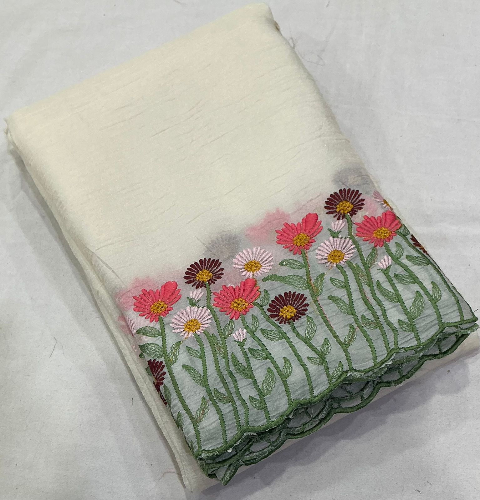 Off white crush emboridery saree.